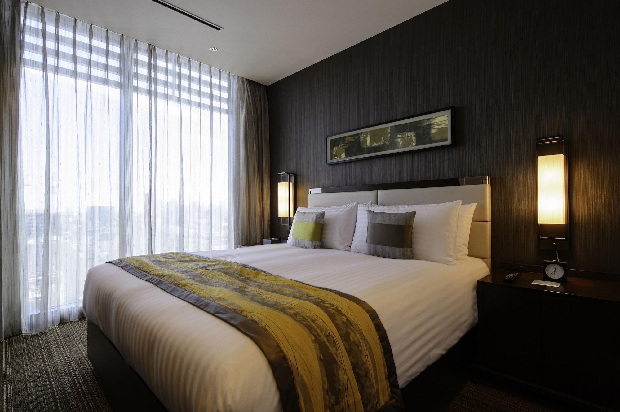 Oakwood Premier Tokyo Hotel Luaran gambar A bedroom at the hotel